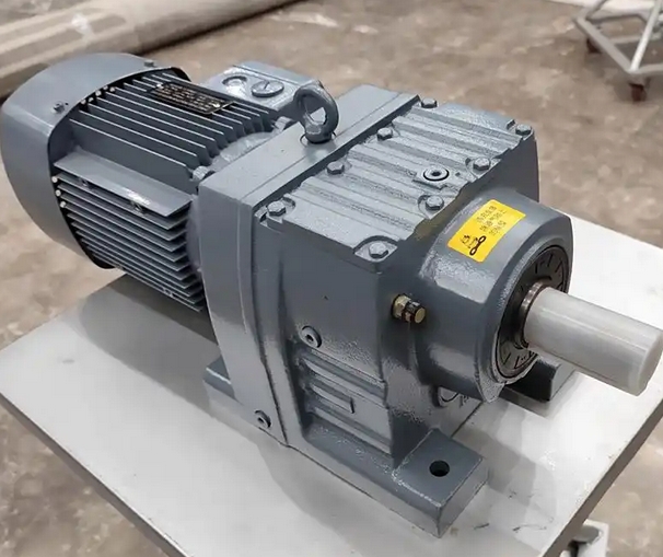 What factors should be considered when choosing a hard tooth surface gear reducer or a soft tooth surface gear reducer
