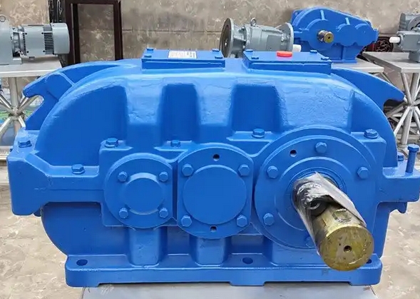 Who should be responsible for cleaning the DCY800-25-1 hard tooth gear reducer