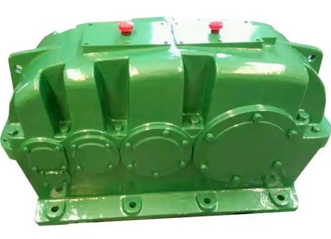 What does the slight impact load specifically refer to in the load characteristic adaptation principle of ZFY560-100-3 reducer?